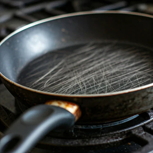 close up of a scratched non-stick pan