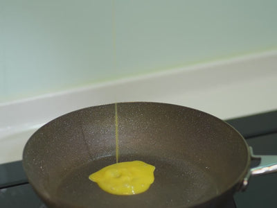 blowing flips egg on non-stick diamond pan